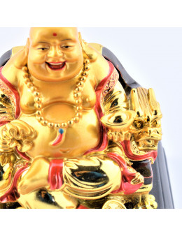 Bouddha dorée assis sur socle bois